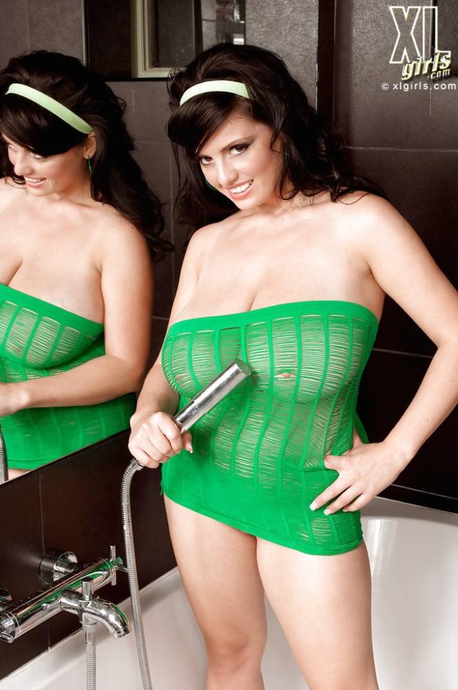 Voluptuous romanian brunette milf Arianna Sinn showing big boobies and masturbating in the bathroom - #1