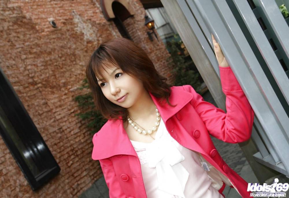 Curious japanese cutie Asako posing in fancy skirt on camera outside - #1