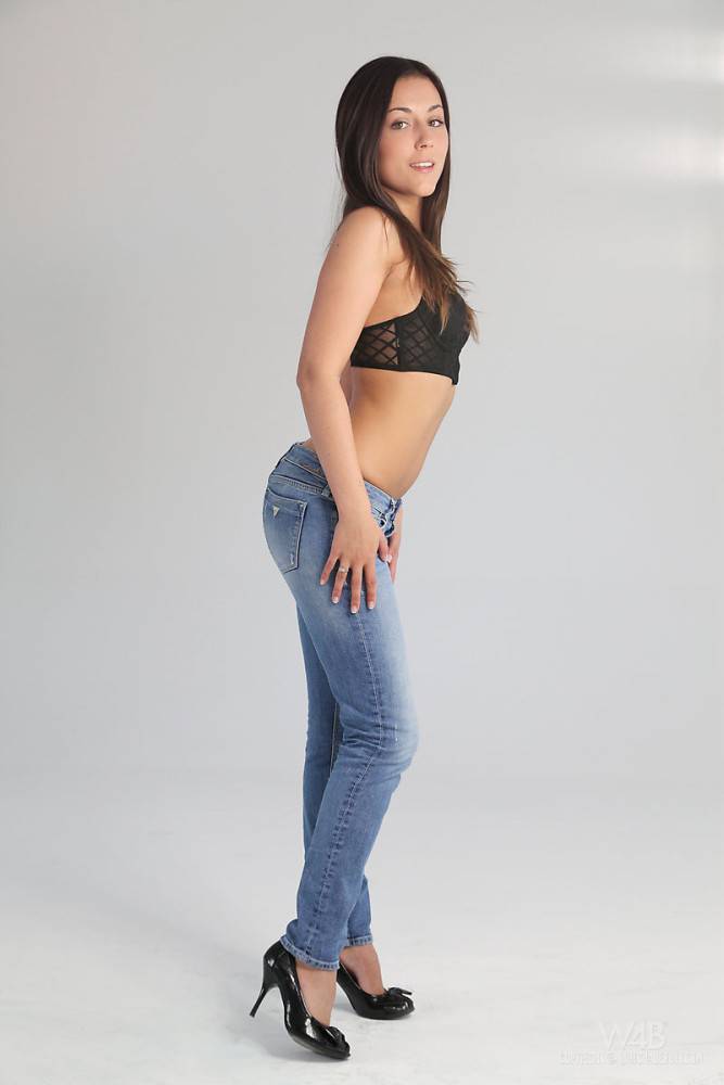 Svelte brunette young Iwia in jeans exhibits tiny tits and spreads her legs - #13