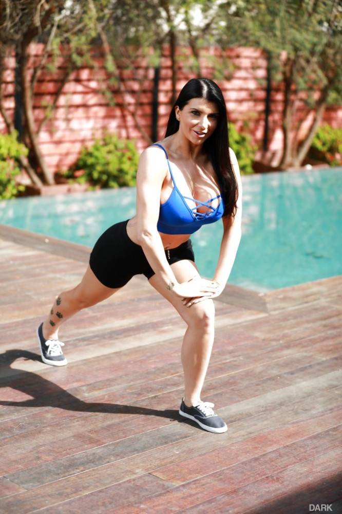 Sexy american brunette porn star Romi Rain showing big boobies and spreading her legs near the pool - #2