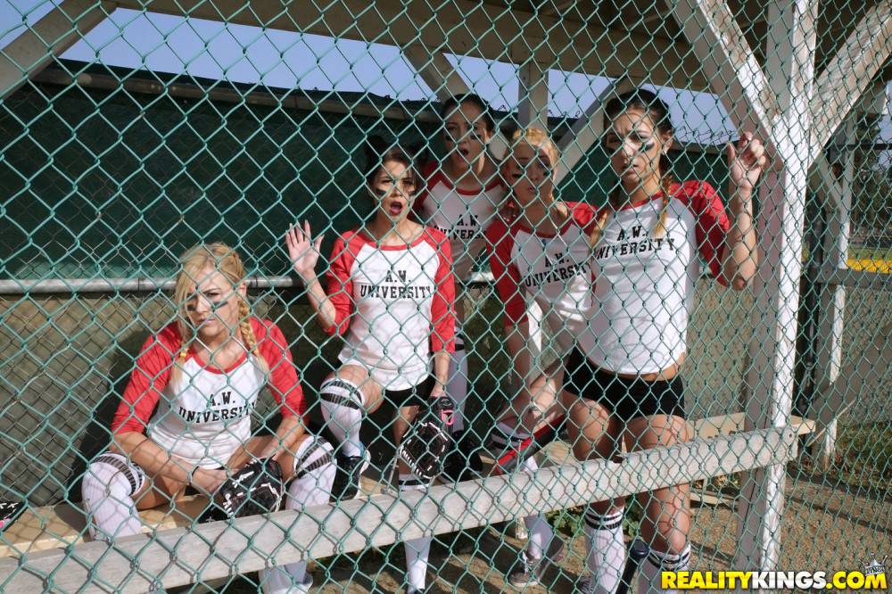 Several busty softball-playing hotties end up strap-on fucking each - #1