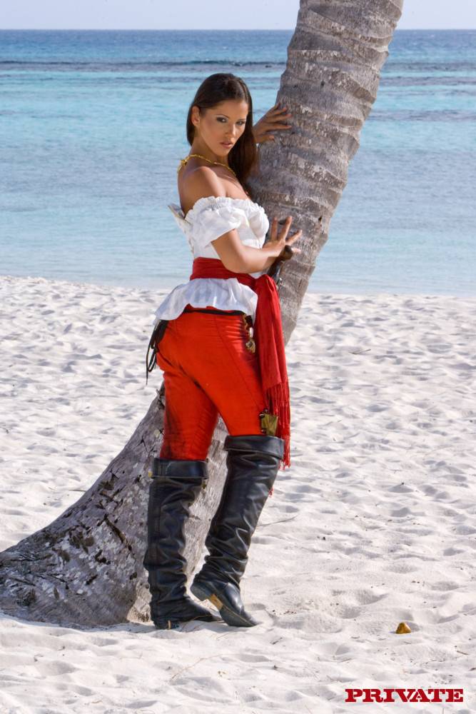 Perfect Bodied Busty Pirate Babe Angel Dark Strips And Poses Naked On Exotic White Sand Beach - #2