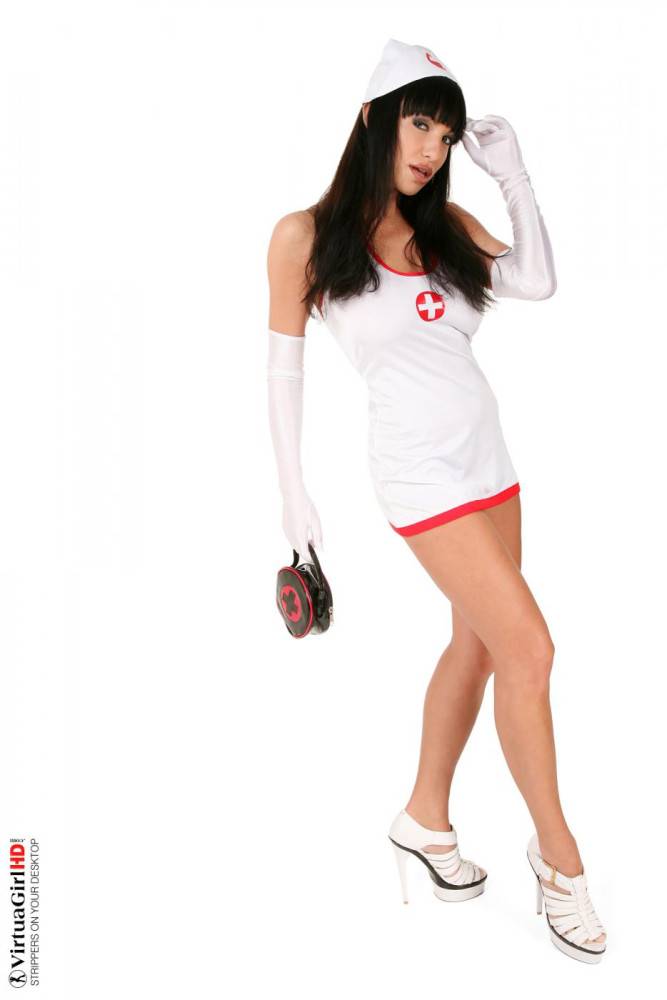Busty Brunette Marta Zawadzka Is Wearing A Tight Fitting Nurse Uniform And Posing. - #8