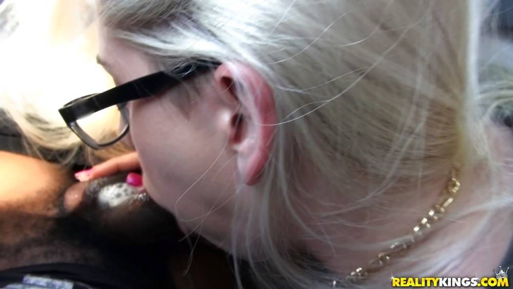 Stunning blonde Nikki Snow in glasses sucks on big black rod and enjoys a cum blast on her face in car - #15