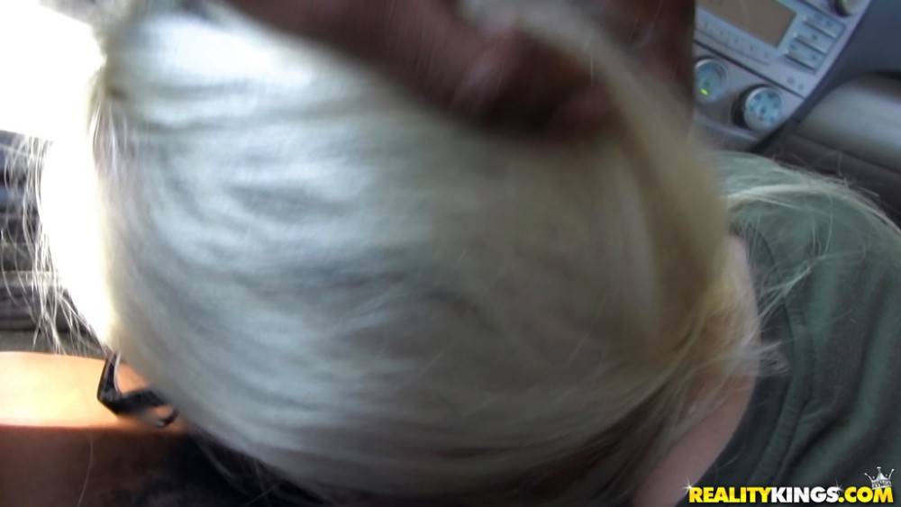 Stunning blonde Nikki Snow in glasses sucks on big black rod and enjoys a cum blast on her face in car - #4