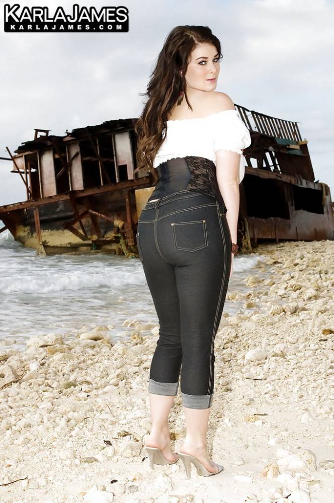 Peachy british dark-haired hottie Karla James in tight jeans exhibits big tits and sexy butt at beach - #1