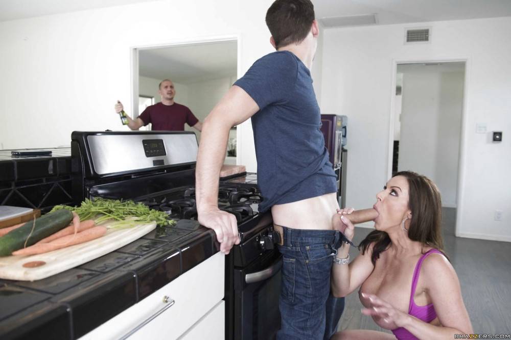 Peachy american dark hair wife Kendra Lust in nice skirt blowing huge cock in the kitchen | Photo: 8212186