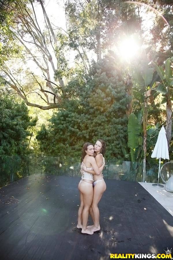 Stunning women Malena Morgan and Lily Love having lesbian fun near the pool | Photo: 8312487