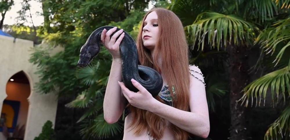 Redhead snake charmer poses nude outdoor - #3