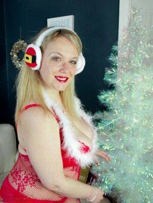 Big titted overweight blonde Sindy Bust sports red lips at Xmas in lingerie on nudesceleb.com