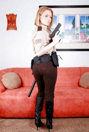 Hot babe in police uniform Krissy Lynn stripping and spreading her legs on nudesceleb.com