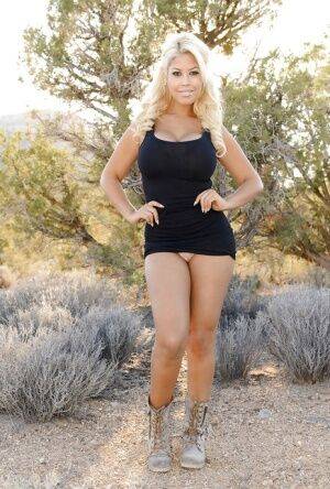 Blonde Bridgette B. shows her nice juicy booty outdoors in the desert on nudesceleb.com