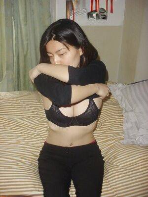 Fine Asian babe Ball is playing with her big mighty bristols on nudesceleb.com