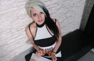 White girl with dyed hair is held prisoner in chains and security cuffs on nudesceleb.com