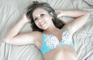 Smiley teenage amateur in lingerie Sasha Hall stripping on the bed on nudesceleb.com