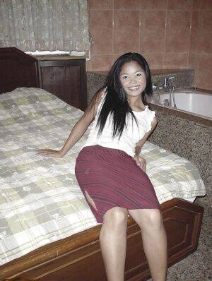 Smoking hot asian babe showing off her petite ass and shaved pussy on nudesceleb.com