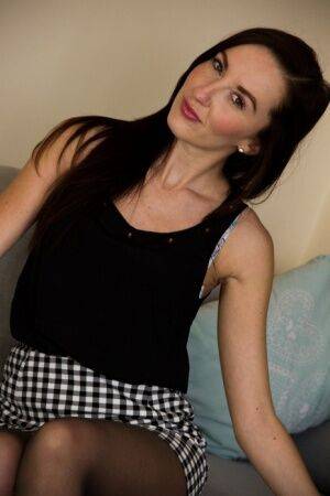 Cute skinny MILF Sophia Smith strips down to her black stockings on nudesceleb.com