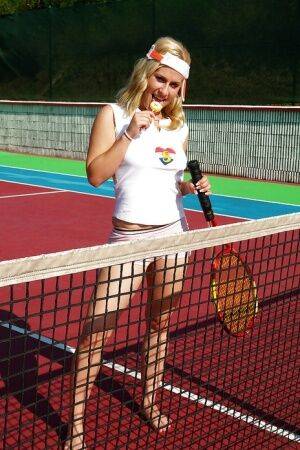 Sporty babe with big tits Angel B toying her cunt on the tennis court on nudesceleb.com