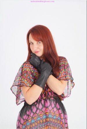 Natural redhead Sammy B model fully clothed in black leather gloves on nudesceleb.com