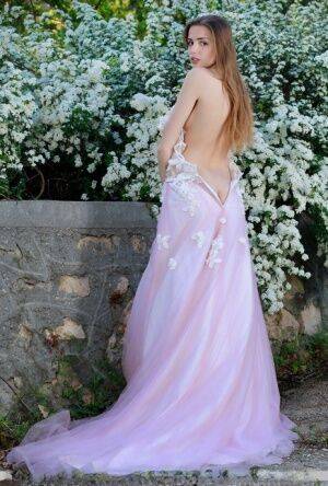 Beautiful girl Elle Tan slips off wedding dress to pose nude in garden on nudesceleb.com