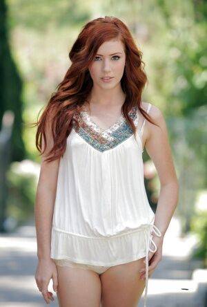 Skinny redhead beauty Elle Alexandra exhibits tiny breast outside on nudesceleb.com