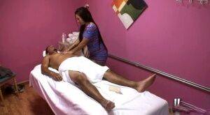 Asian brunette Morgan Lee dose handjob to a guy while massaging him on nudesceleb.com