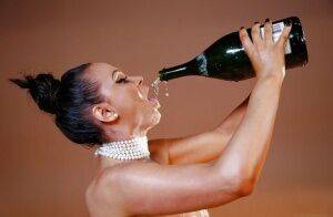 Sensual milf Nikki Benz is drinking champagne like a pornstar! on nudesceleb.com