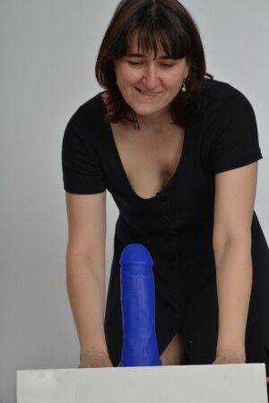 Amateur slut with saggy boobs riding a big blue dildo so damn good on nudesceleb.com