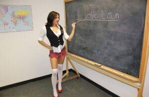 Naughty schoolgirl Cherry Poppins seduces a fellow student in slut wear on nudesceleb.com