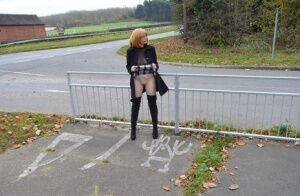 Mature redhead Barby Slut exposes herself in public while wearing OTK boots on nudesceleb.com