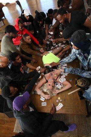 Platinum blonde slut gets gangbanged on a poker table by black men on nudesceleb.com