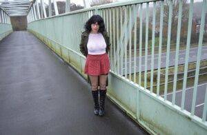 Amateur woman Barby Slut exposes herself in public while wearing black boots on nudesceleb.com