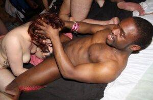 Amateur individuals take part in an interracial group sex scene on nudesceleb.com