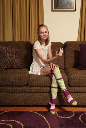 Adorable teen Alicia Williams takes a selfie before getting naked in OTK socks on nudesceleb.com