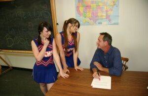 2 cheerleaders jerk off their geography teacher on top of his desk on nudesceleb.com