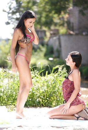 Stunning lesbians Nathaly Cherie and Bailey Ryder having outdoor sex on nudesceleb.com