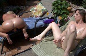 Chubby amateur Dee Siren has lesbian sex with a young girl on a lounge chair on nudesceleb.com