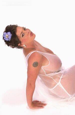 Buxom Linsey Dawn poses to flaunt her droopy tatas in sheer lingerie on nudesceleb.com