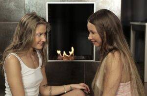 Teen lesbians Taylor Sands & Tiffany Tatum 69 on a rug in front of a fireplace on nudesceleb.com