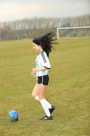 Barely legal soccer player removes her uniform before masturbating on a bench on nudesceleb.com