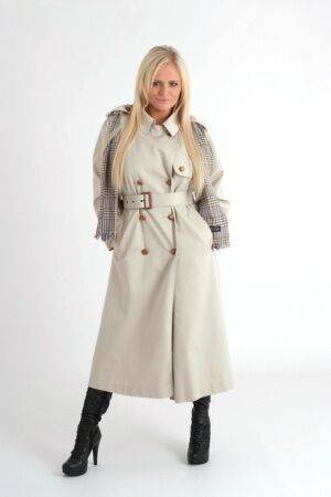 Platinum blonde chick Charlie G removes an overcoat to model lingerie in boots on nudesceleb.com