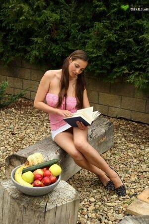 Amateur teen Connie Carter takes a study break to masturbate in garden on nudesceleb.com