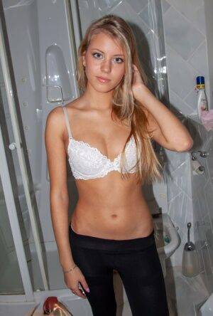 Barely legal blonde Barbara D uncups her perky boobs in yoga pants on nudesceleb.com