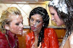 Lascivious fully clothed lesbians making some messy bukkake action on nudesceleb.com