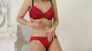 Amateur model Kacie Lames lets her big saggy tits free as she changes lingerie on nudesceleb.com