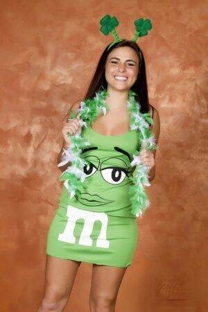 Amateur Kaley Kade flashes while wearing a green M&M dress on St Patty's Day on nudesceleb.com