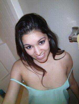 Petite amateur brunette cutie Selena takes a selfie of her hot tits and ass on nudesceleb.com