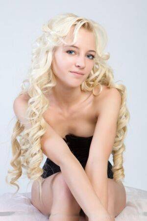 Cute blonde Alysha A showing naked young girl parts in black bustier on nudesceleb.com