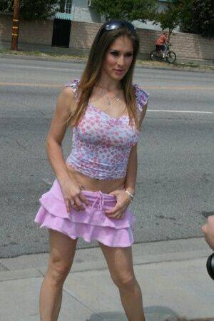 MILF babe in a shirt skirt Felony shows her big boobs outdoor on nudesceleb.com