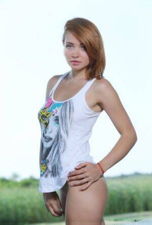 Ukrainian solo model Kika shows of her shaved pussy next to a river - Ukraine on nudesceleb.com